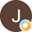 J in a brown circle